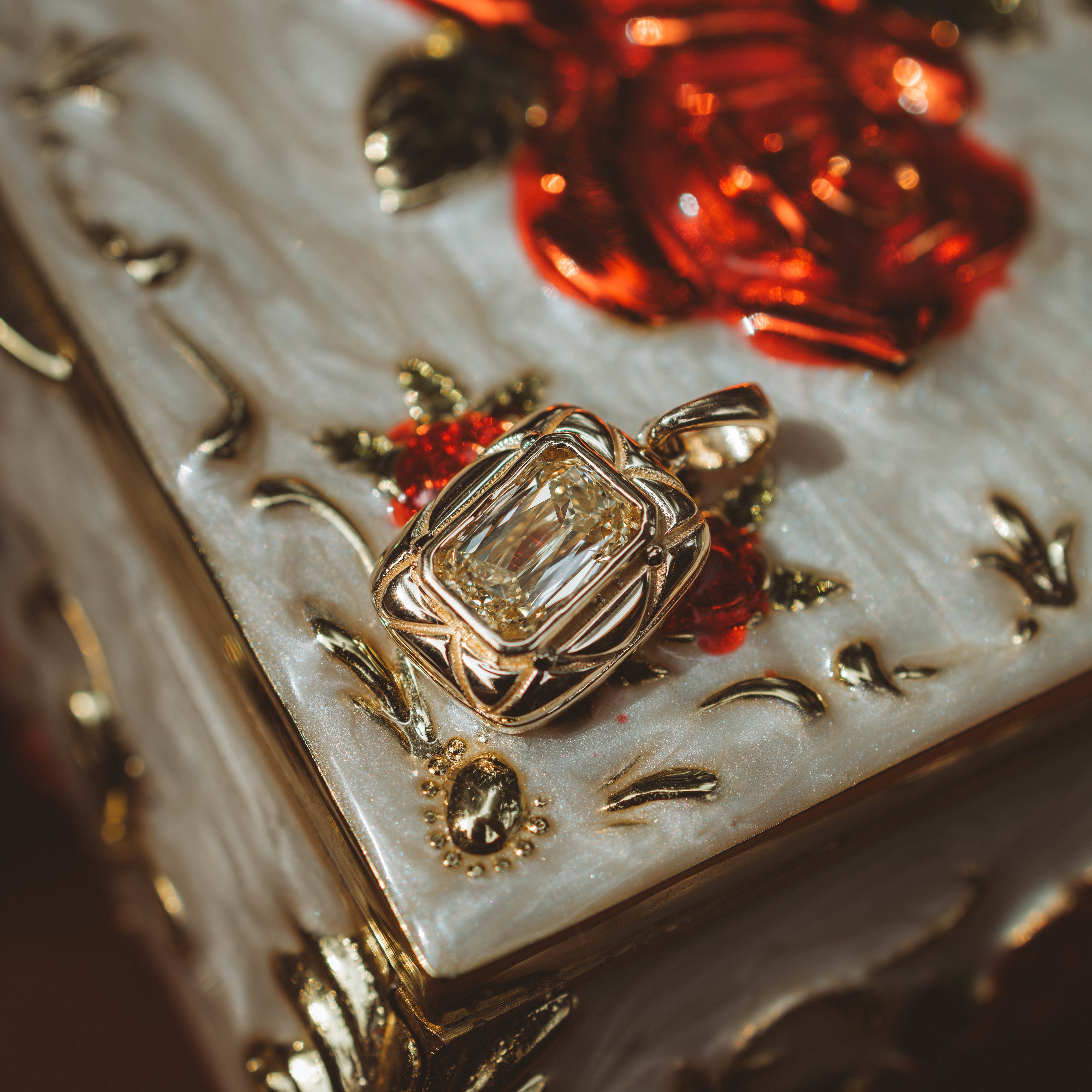 yellow pendant on jewelry box