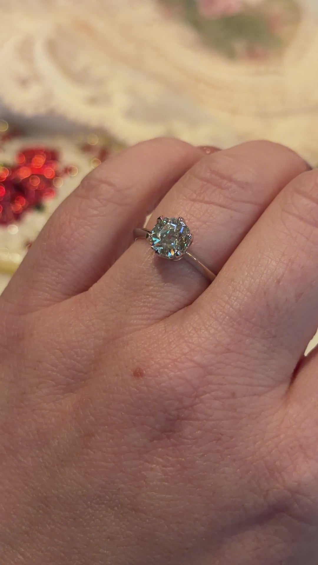 diamond ring worn on hand indoor lighting