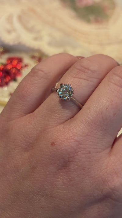 diamond ring worn on hand indoor lighting