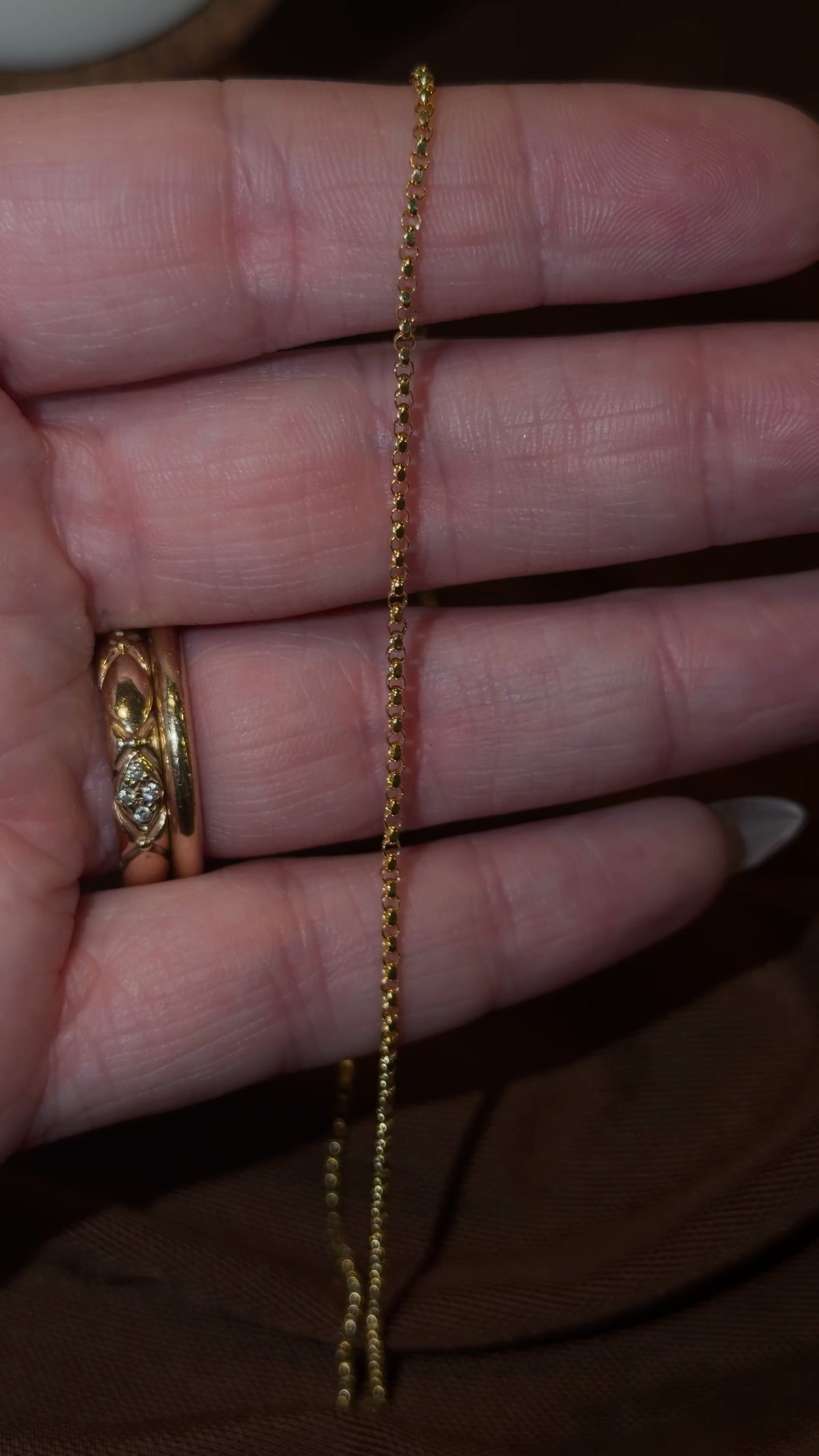 Video of the 14k gold petite rolo chain in motion