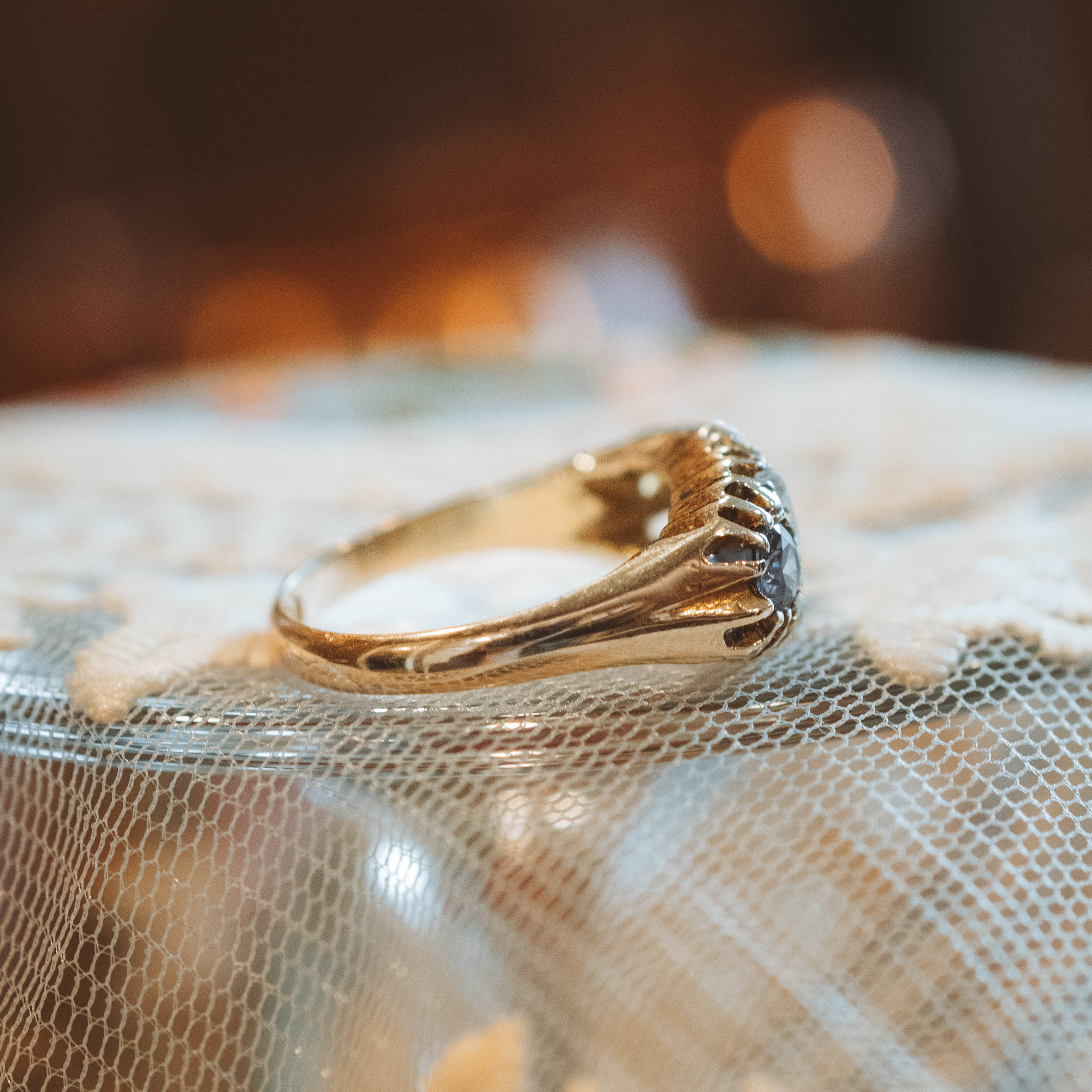 antique Gold ring on a textured fabric background